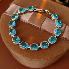 Silver-tone tennis bracelet with oval blue zircon stones — Azure Oval Zircon Tennis Bracelet.