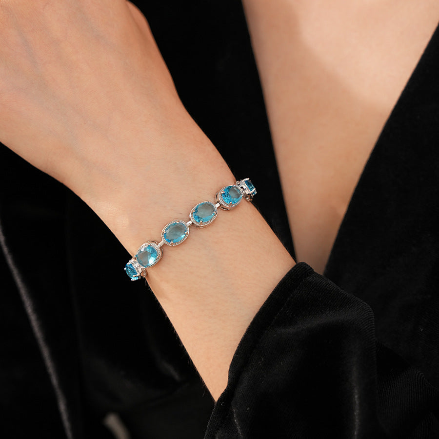 Silver-tone tennis bracelet with oval blue zircon stones — Azure Oval Zircon Tennis Bracelet.