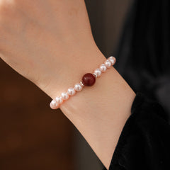 Blush Shijia pearl bracelet with a crimson agate centerpiece and pavé spacers — Crimson Kiss Pearl Bracelet by Glazenya.