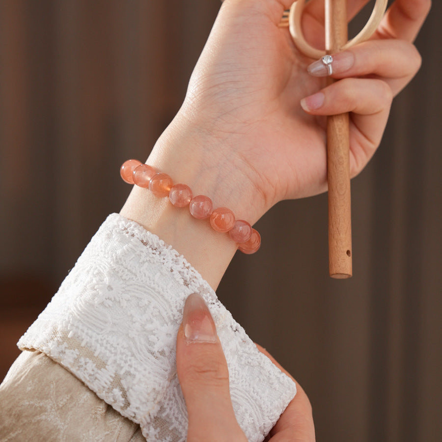 Peach-toned natural red agate beaded bangle with glossy round stones — Peach Glow Agate Bangle.