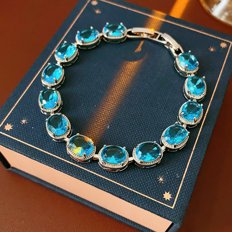 Silver-tone tennis bracelet with oval blue zircon stones — Azure Oval Zircon Tennis Bracelet.