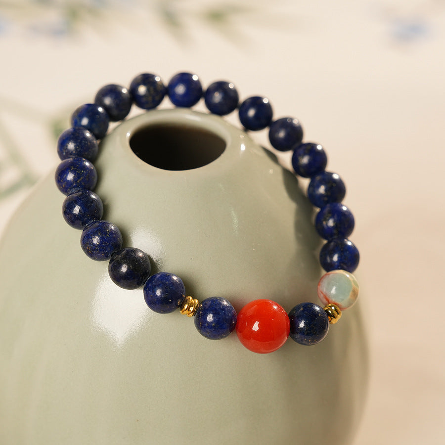 Lapis lazuli beaded bracelet with red accent bead and gold spacers — Midnight Sun Lapis Bracelet by Glazenya.