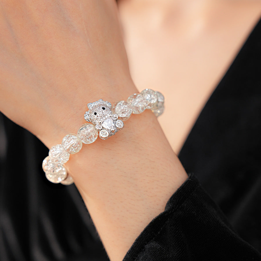 Clear crackle-glass beaded bracelet with pavé bear charm holding a heart — Glacial Heart Bear Bracelet.